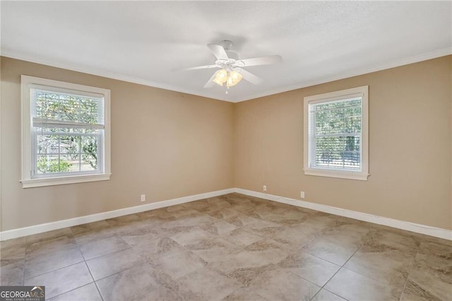 spare room with ceiling fan and crown molding