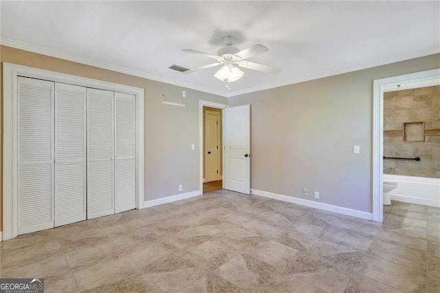 unfurnished bedroom with connected bathroom, a closet, ceiling fan, and crown molding