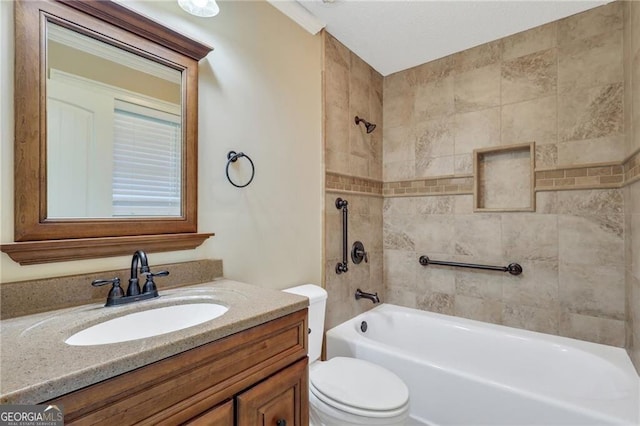 full bathroom with toilet, tiled shower / bath, and vanity