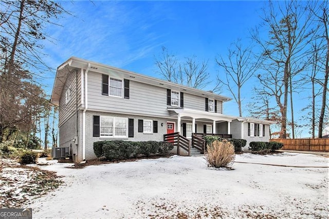 view of front of house featuring a porch and central AC unit