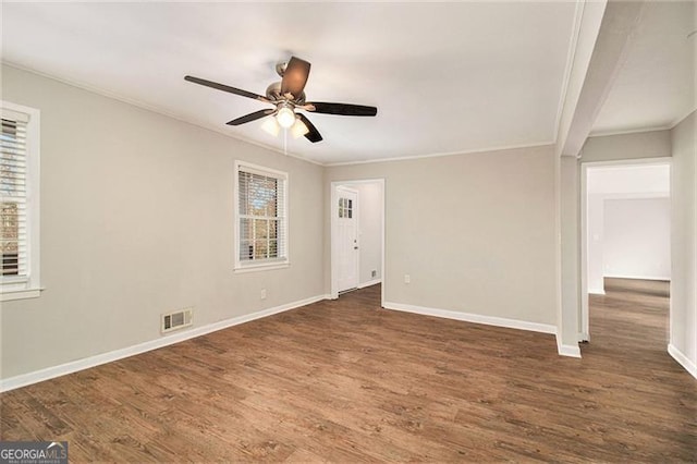 unfurnished room featuring ornamental molding, ceiling fan, and dark hardwood / wood-style floors