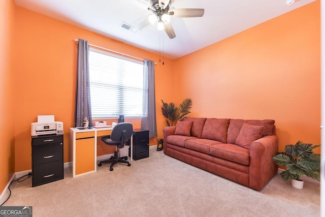 carpeted office with ceiling fan