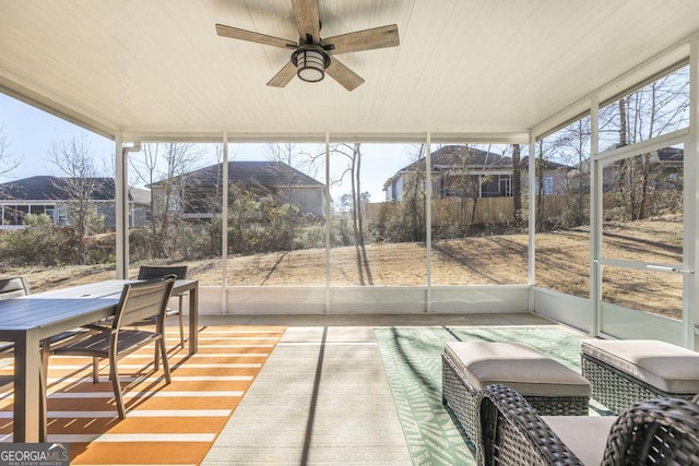 sunroom featuring ceiling fan