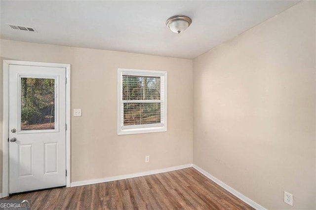 entrance foyer with dark hardwood / wood-style floors