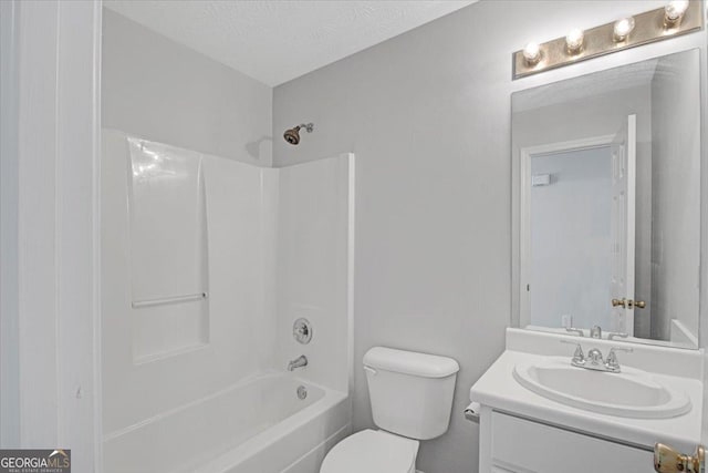 full bathroom featuring bathtub / shower combination, a textured ceiling, toilet, and vanity