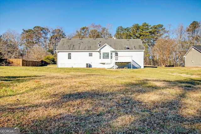 back of house featuring a yard