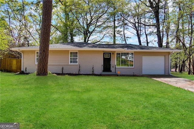 ranch-style home featuring a front lawn and a garage