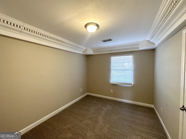 carpeted spare room featuring crown molding