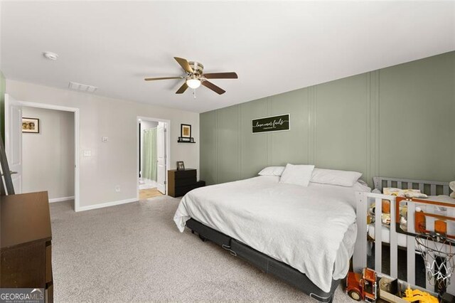 carpeted bedroom with ceiling fan