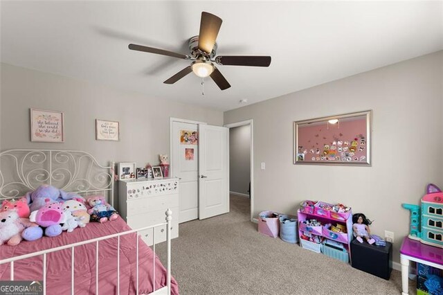 carpeted bedroom with ceiling fan