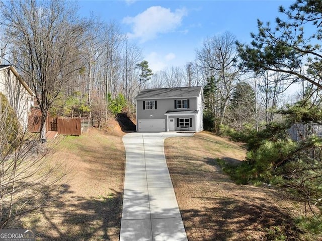 traditional-style house with driveway and an attached garage