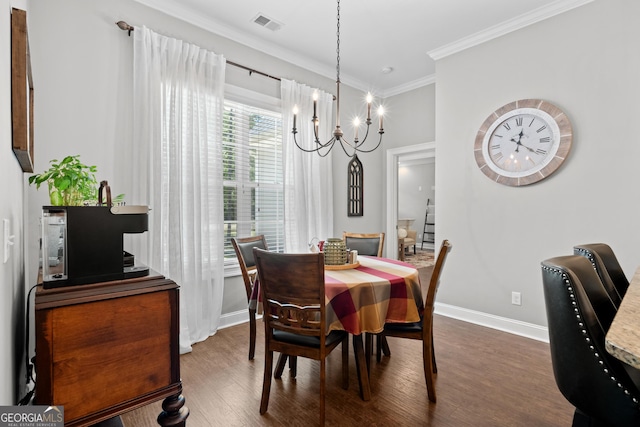 dining area with ornamental molding, dark hardwood / wood-style flooring, and plenty of natural light