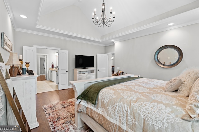 bedroom with a notable chandelier, crown molding, hardwood / wood-style floors, and a raised ceiling