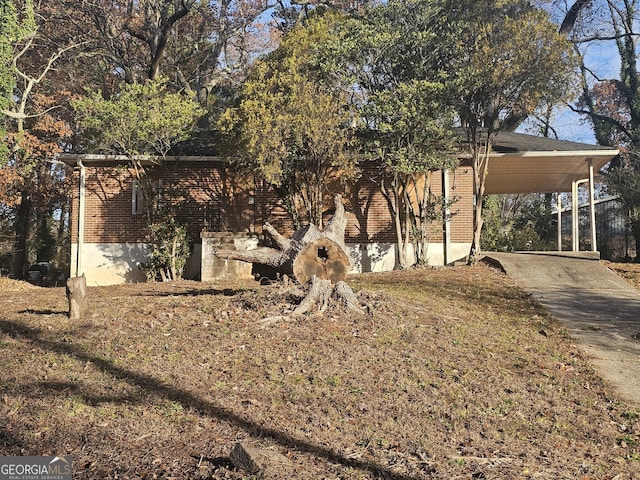 view of side of property with a carport