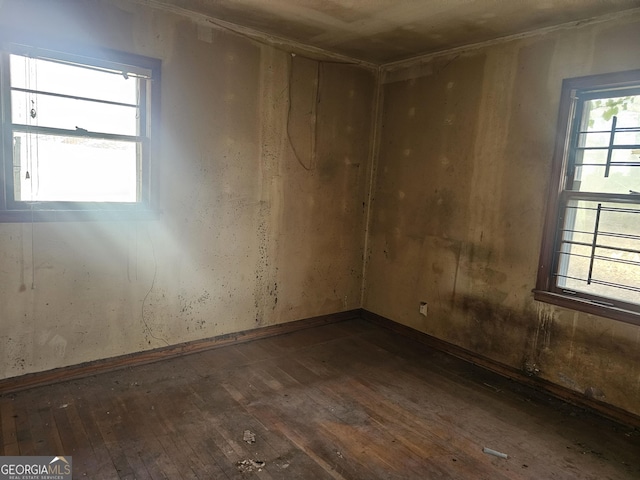 unfurnished room featuring dark hardwood / wood-style flooring