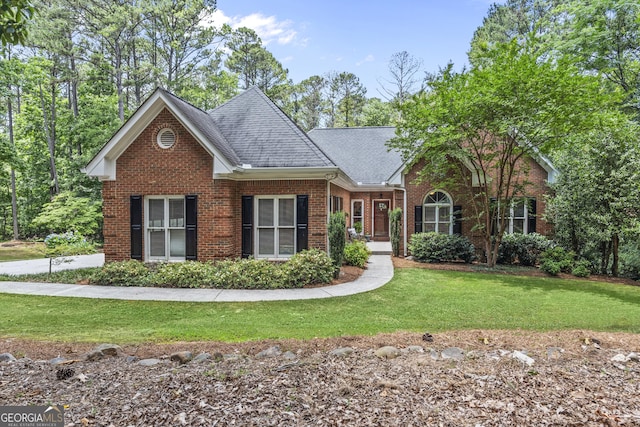 view of property featuring a front lawn