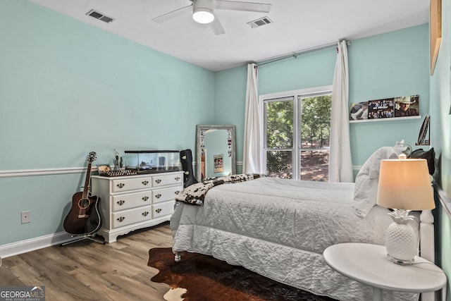 bedroom with ceiling fan and light wood-type flooring