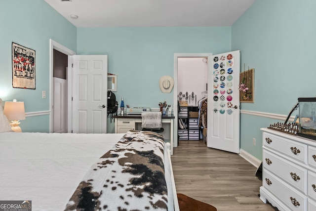 bedroom featuring hardwood / wood-style floors
