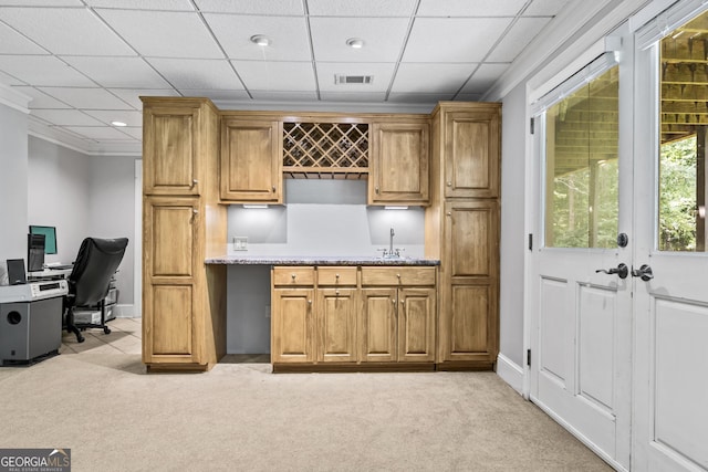 bar with sink, a drop ceiling, and light carpet