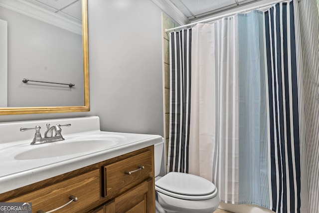bathroom with toilet, curtained shower, ornamental molding, and vanity