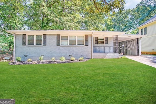 ranch-style home featuring a front yard and a carport