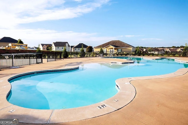 view of swimming pool with a patio