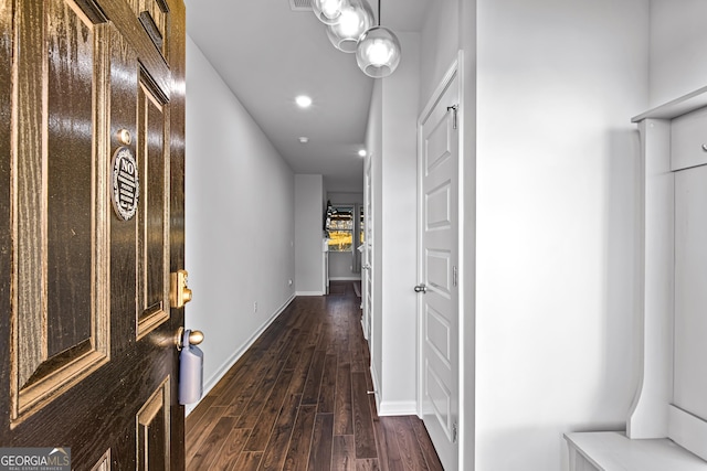 hallway with dark wood-type flooring