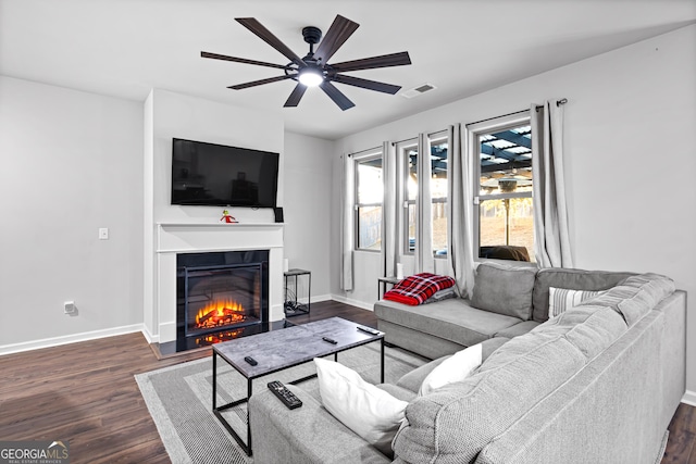 living room with ceiling fan and dark hardwood / wood-style floors