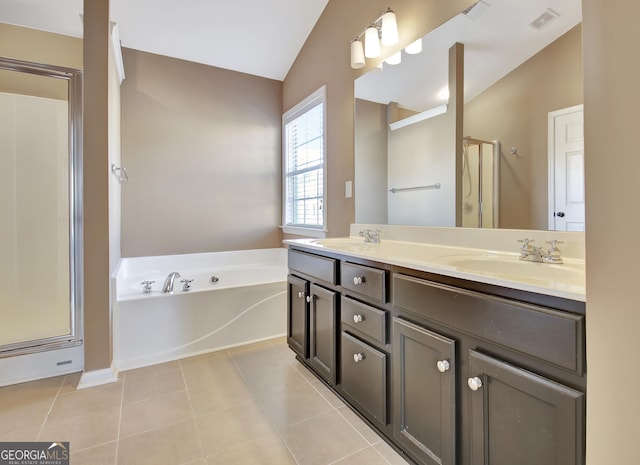 full bathroom featuring tile patterned flooring, visible vents, a shower stall, a bath, and a sink