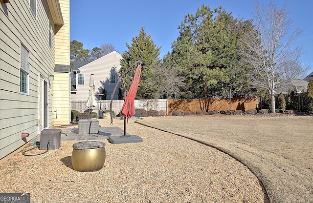 view of yard with a patio and a fenced backyard