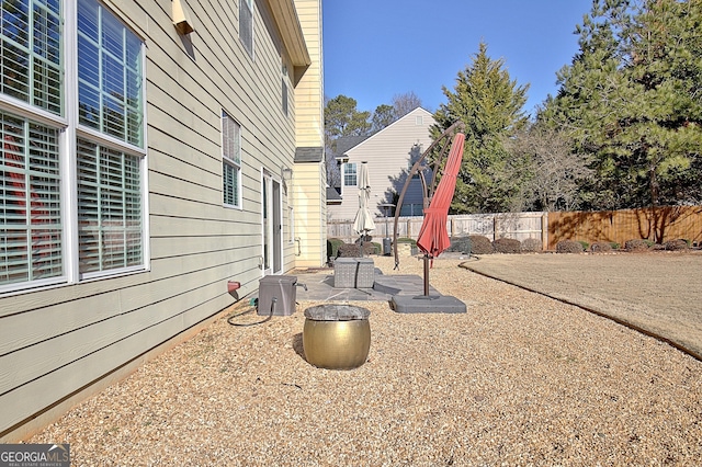 view of yard featuring a patio area and a fenced backyard