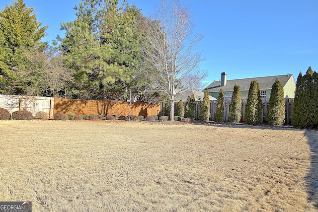 view of yard with fence