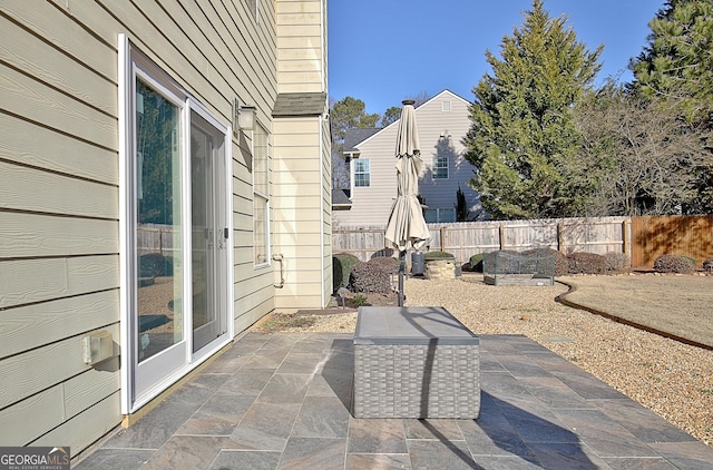 view of patio featuring fence