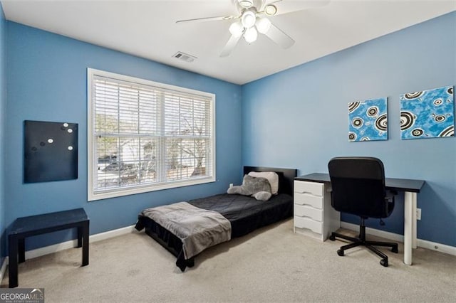 carpeted bedroom with ceiling fan