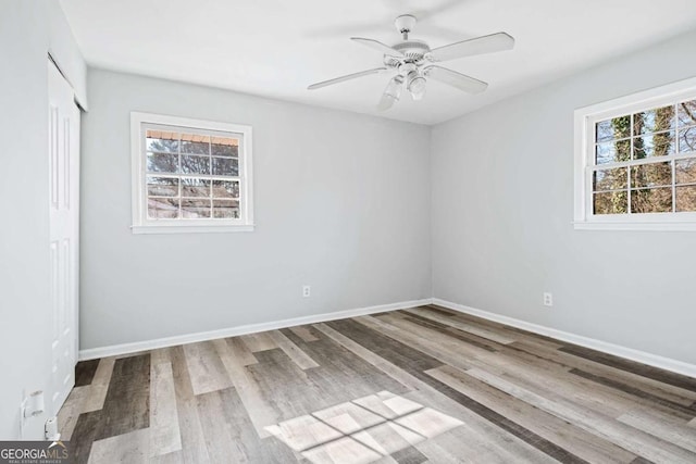 unfurnished room featuring ceiling fan and light hardwood / wood-style floors