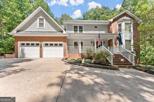 front of property with a garage and covered porch