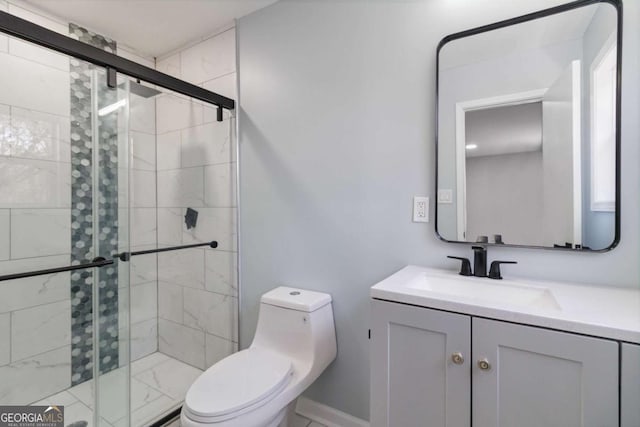 bathroom featuring toilet, vanity, and walk in shower