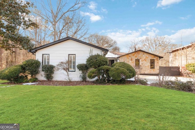 view of home's exterior with a yard