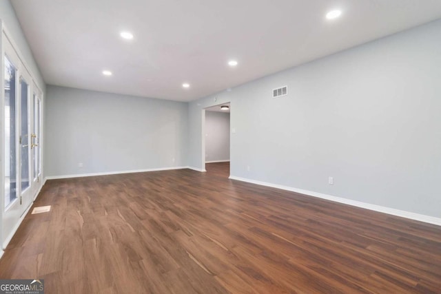 empty room featuring dark wood-type flooring