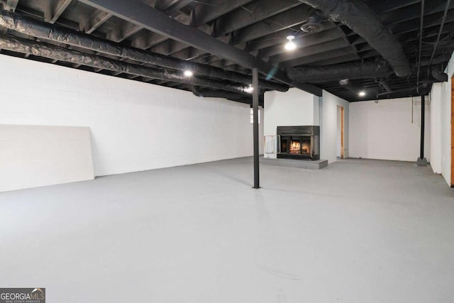 basement with a multi sided fireplace