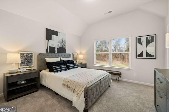 bedroom with light carpet and lofted ceiling