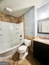 full bathroom with toilet, vanity, and bathing tub / shower combination