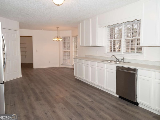 kitchen with stainless steel dishwasher, white cabinetry, sink, and pendant lighting