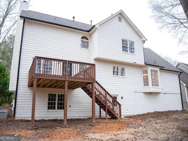 rear view of property with a wooden deck