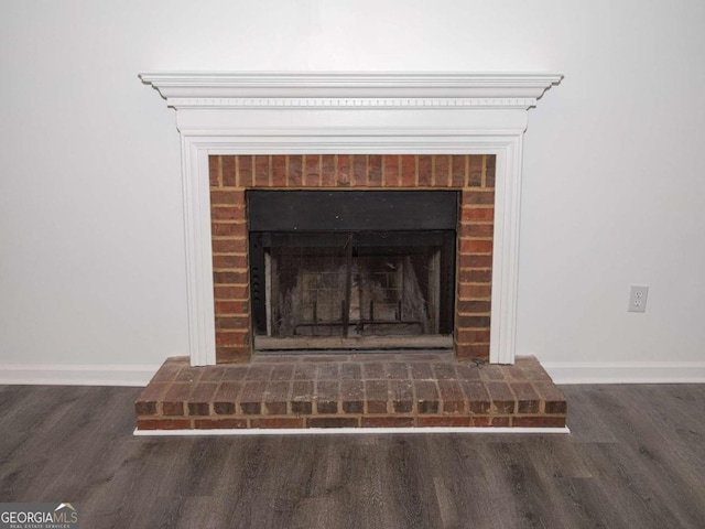 interior details with a fireplace and hardwood / wood-style flooring