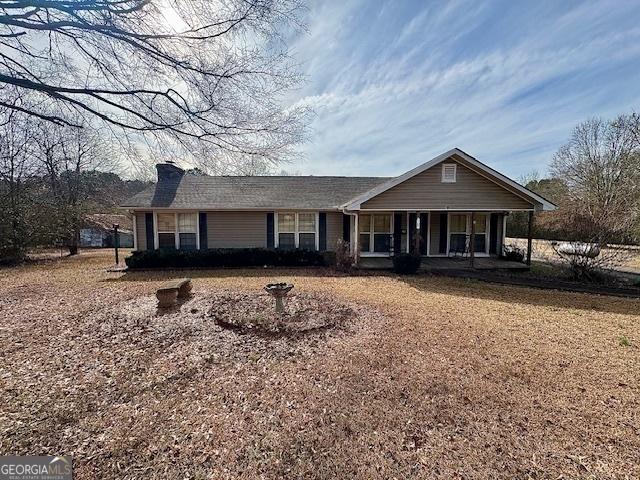 ranch-style home featuring covered porch