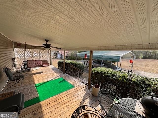 wooden terrace featuring an outdoor hangout area and ceiling fan