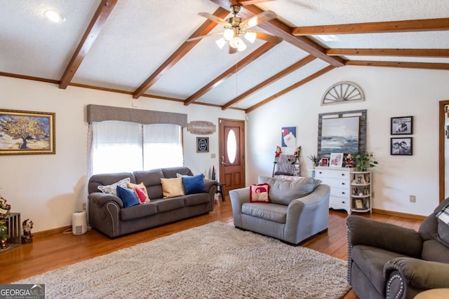 living room featuring wood-type flooring, a textured ceiling, lofted ceiling with beams, and ceiling fan