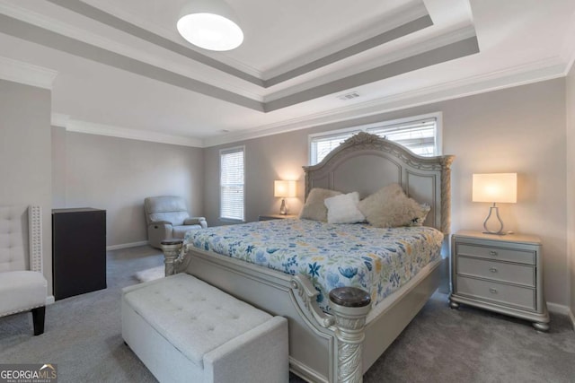 bedroom featuring ornamental molding, a tray ceiling, multiple windows, and dark carpet