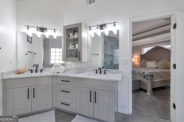 bathroom with vanity, tile patterned flooring, and a shower with shower door